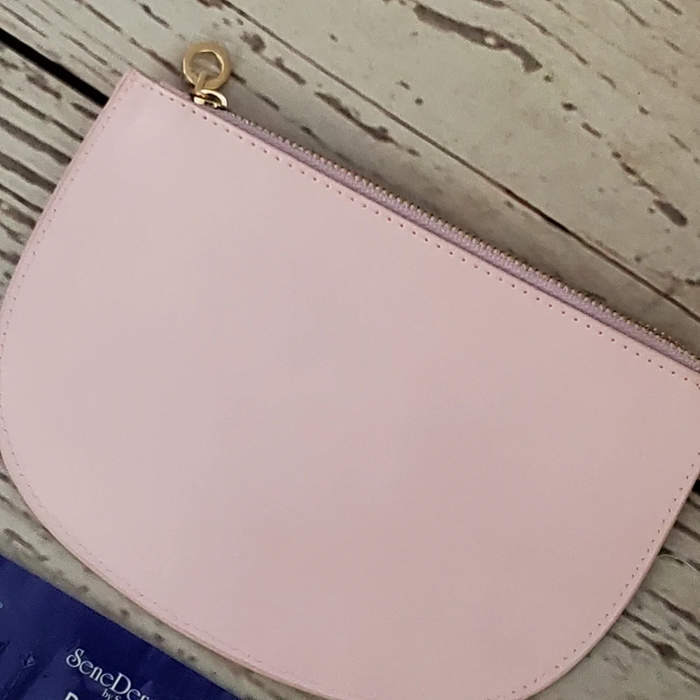 SeneGence pearlized pink vinyl makeup bag with skin care samples